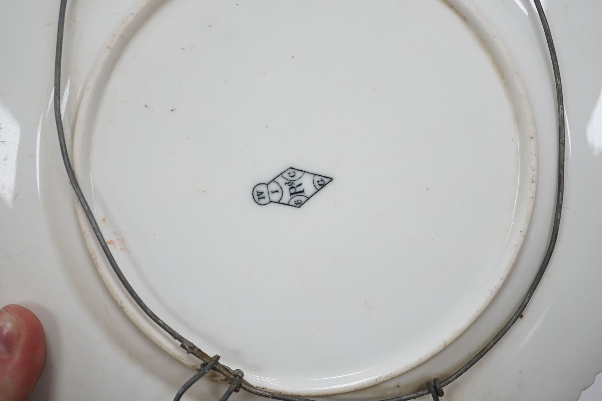 A small collection of Victorian porcelain tea cups and saucers and sundry dessert plates